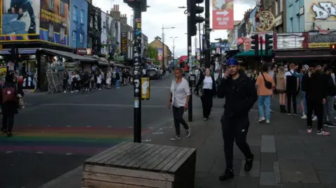 Getty Images Image from 2022 showing people crossing a road in the Camden High Street area