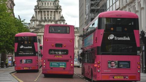 Translink Metro buses on the road outside Belfast City Hall