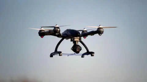 A drone flying in the sky. 