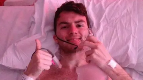 Family Stephen with his thumbs up