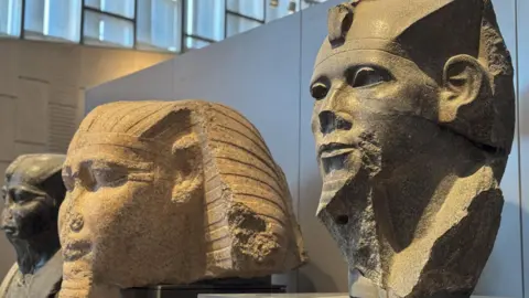 Mohamed Hossam/EPA Pharaonic status displayed at the new halls of the Grand Staircase of the Grand Egyptian Museum during the trial partial operation in Giza, Egypt, - Tuesday 15 October 2024.