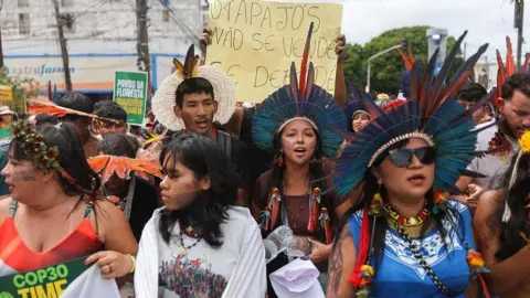 Reuters Protesters march in Belem, Brazil, near the COP30 climate summit. 