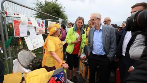 PA Media Jeremy Corbyn speaks to anti-fracking protesters
