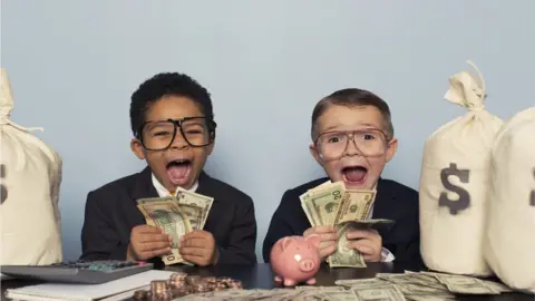 Getty Images kids counting dollars