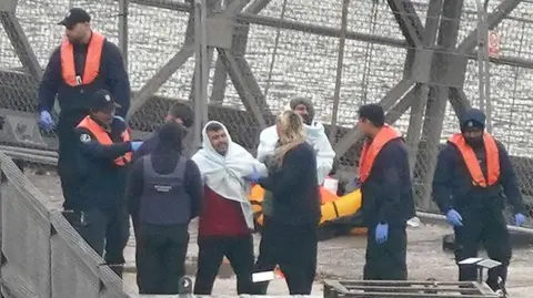 GARETH FULLER/PA WIRE A group of people thought to be migrants are brought in to Dover from a Border Force vessel