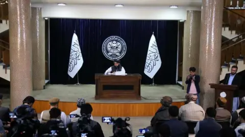EPA Taliban's government spokesperson Zabihullah Mujahid talks to journalists during a press conference in Kabul, Afghanistan, 29 June 2024.
