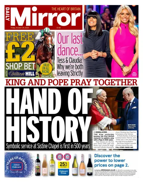 "Hand of history: King and Pope pray together" reads the headline on the front page of the Daily Mirror.