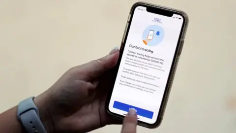 Reuters The coronavirus disease (COVID-19) contact tracing smartphone app of Britain's National Health Service (NHS) is displayed on an iPhone