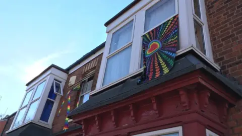 Flag draped outside window