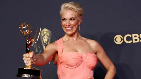 Reuters Hannah Waddingham poses with her award for outstanding supporting actress in a comedy series for "Ted Lasso", at the 73rd Primetime Emmy Awards in Los Angeles, U.S., September 19, 2021