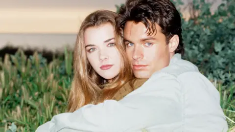 Getty Images Christie Clark as Carrie Brady being embraced by Patrick Muldoon as Austin Reed in Days of Our Lives in 1993