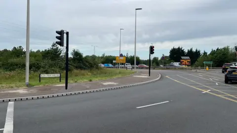 Bedford Borough Council The Paula Radcliffe Way, in Bedford, now open, showing a roundabout and cars on it