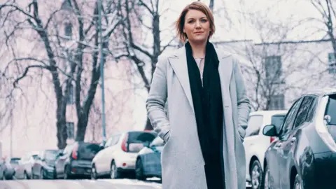 Kristina Bo Kristina Bo, Secretary General of the Norwegian Electric Vehicle Association, stands on a snow-covered street