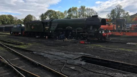 Flying Scotsman being repaired on tracks 