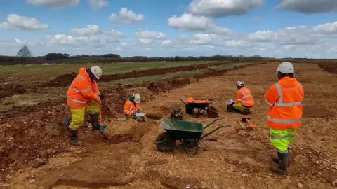 Oxford Cotswold Archaeology Workers on the A417