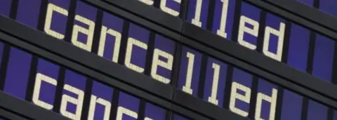 Getty Images Cancelled sign at airport