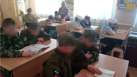 Perevalsk Special School Ukrainian children wearing Russia military uniforms