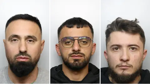 Three mugshots. All the men have short brown hair and facial hair. The middle one is wearing glasses