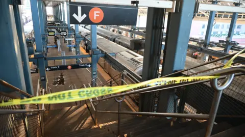 Getty Images Police investigate Brooklyn's Coney Island-Stilwell Avenue station after a woman on a subway car was set on fire and died