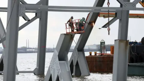 Getty Images Workers on Key Bridge