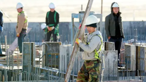 AFP/Getty North Korean workers on a building site in the Mongolian capital Ulaanbaatar.