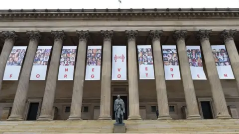Getty Images Banners with images of the 96 victims have been hung at St George's Hall