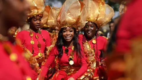 PA Media young performer at carnival