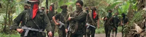 Getty Images Guerrilla soldiers of the National Liberation (ELN),on patrol in Sarare, 27 February, 2000 in the Department of Arauca