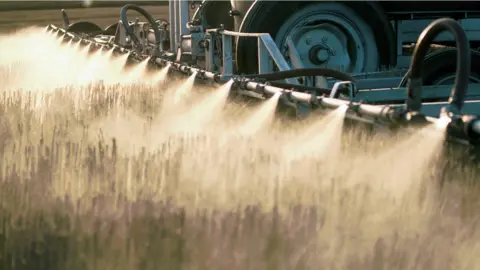 Getty Images Spraying herbicide