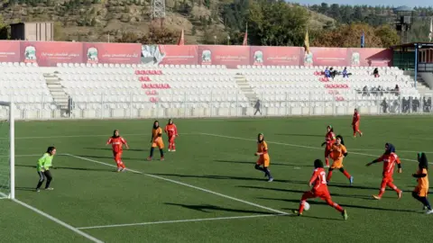 AFP Afghan female football players vie for the ball during a football match in Kabul on November 9, 2013.