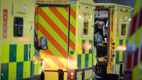 Getty Images Queueing ambulances