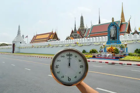 Jorge Silva / Reuters A clock showing the time at noon at Wat Phra Si Rattana Satsadaram (The Temple of the Emerald Buddha, also known as The Grand Palace) in Bangkok, Thailand