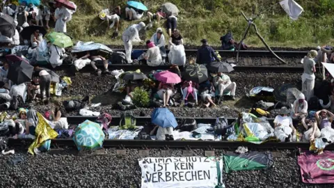 Getty Images Climate activists blocked the rail tracks leading to the Hambach surface mine