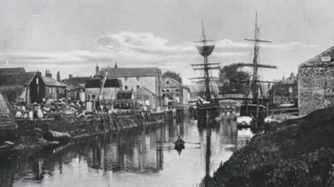 Arundel Historic Tours A black and white photo of a large tea clipper sailing into an inland port.