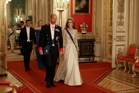 Phil Noble/REUTERS Britain's William, Prince of Wales and Catherine, Princess of Wales walk to attend the State Banquet during U.S. President Donald Trump's state visit, at Windsor Castle
