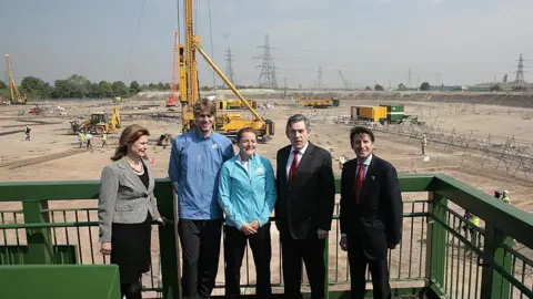 Getty Images Picture taken on 22 May 2008 in east London during a visit to the London 2012 Olympic site. Shows Britain's then Prime Minister Gordon Brown, his wife Sarah Brown, chairman of the 2012 committee Sebastian Coe, British athletes Goldie Sayers and Chris Thomlinson.