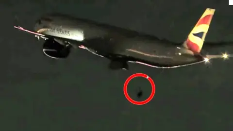 Moment the plane's rear wheel falls off just after take-off