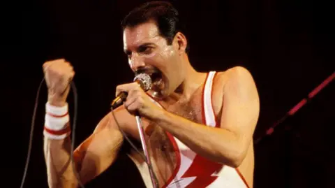 Freddie Mercury performs in Concert
