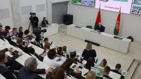 EPA A handout picture made available by Belarus President press service shows Belarusian President Alexander Lukashenko (R) attending a press conference after casting his ballot in the presidential elections at a polling station in Minsk, Belarus, 26 January 2025