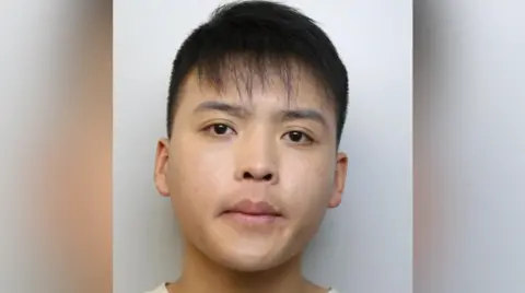 Mushot of Daoyan Shang, 20, involved in a phone "smishing" scam on the tube 