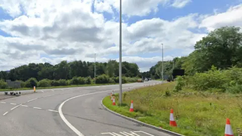 Looking along the Long Ashton Bypass from a roundabout, with cones and different lanes visible