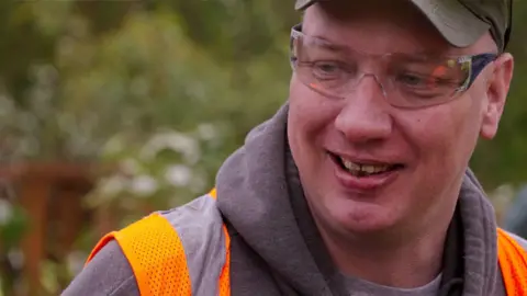 Gene Wool photographed in a safety vest in Pennsylvania 