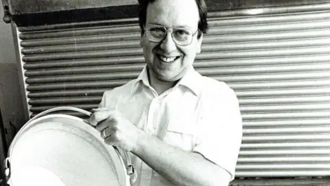 The Harbour Bar, Scarborough A black and white archive photo of Giulian pouring a bucket of ice cream in the 1980s.