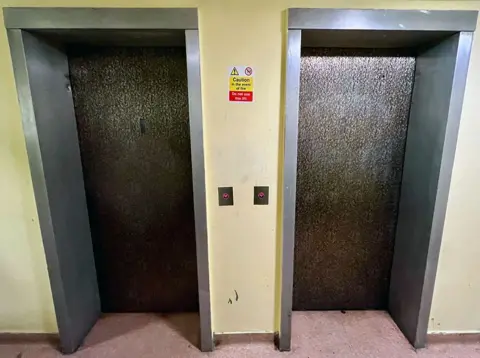 An image of two lifts, for odd and even floors, at Invicta House