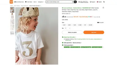 Natalie Ramsell-Lee A screenshot of one of Natalie's clothing designs worn by her daughter appearing on Temu. The design is a white T-shirt with a number three in gold glitter. 