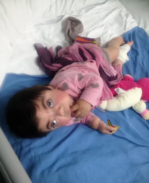 Child in pink pyjamas