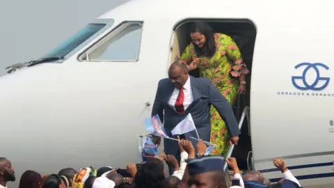 Reuters DR Congo opposition leader Jean-Pierre Bemba disembarks from a plane at N'djili International Airport in Kinshasa, Democratic Republic of Congo -1 August 2018