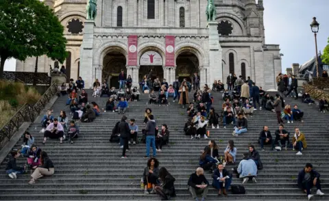 Getty Images Police had to evacuate crowds from the steps of the Sacré-Cœur in Paris on Tuesday