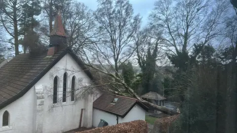 St Margarets Church/BBC Weather Watchers A tree down on a church roof in New Galloway