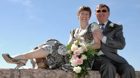 Supplied Amanda and David dressed smartly